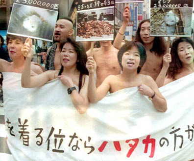  Eight naked members of the No Fur Foundation, covered with a banner which reads “We'd Rather Go Naked Than Wear Fur", stroll through Tokyo's downtown Ginza street 03 November to protest against fur fashion, during a time when Tokyo's ready-to-wear shows are in full swing. (Colour Key: white banner wrapping bodies.) 04